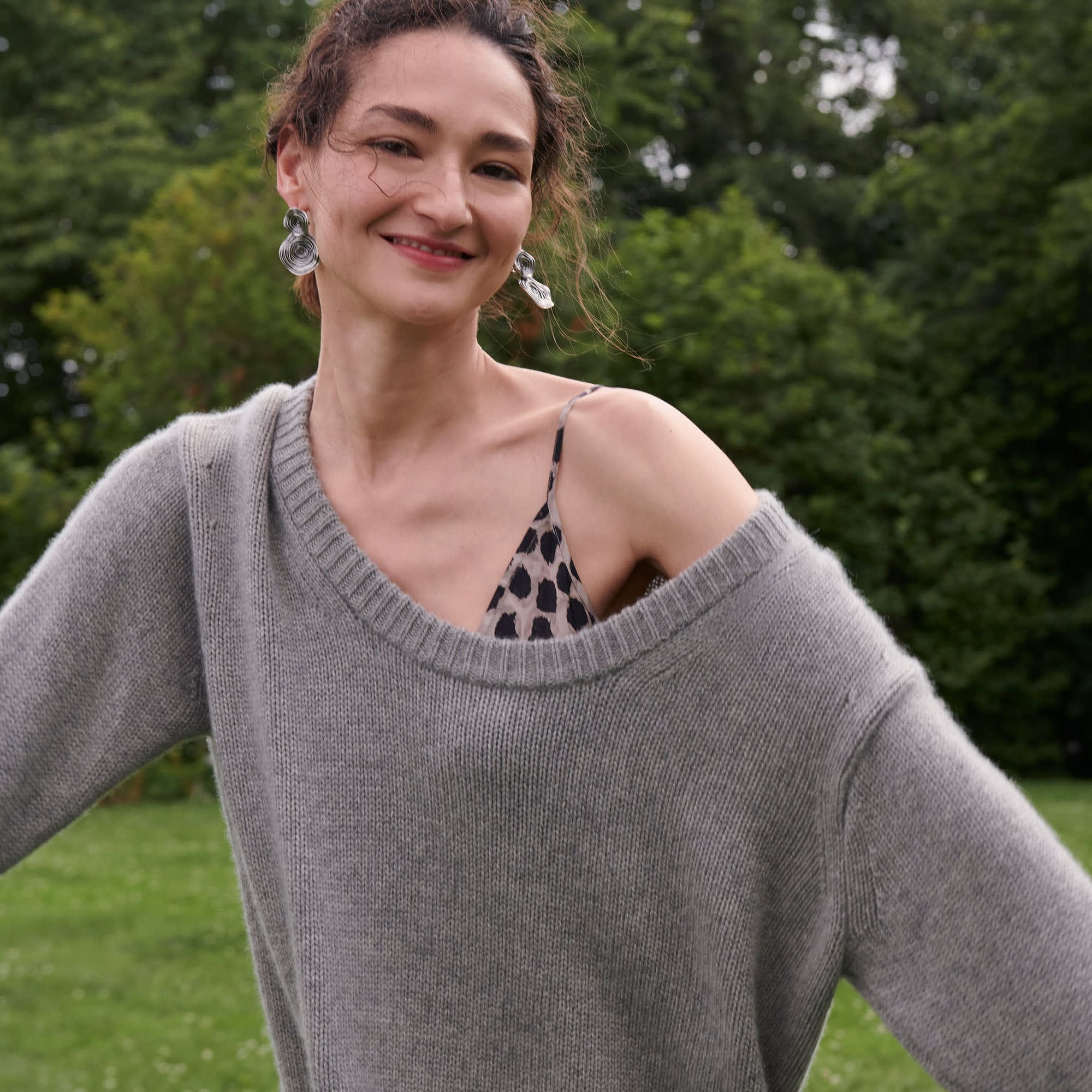 Front image of a woman standing wearing the Lisey Cami—Sahara Print Washable Silk in Tan/Black | Exclude