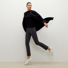 Front image of a woman standing wearing the foster pant in monsoon
