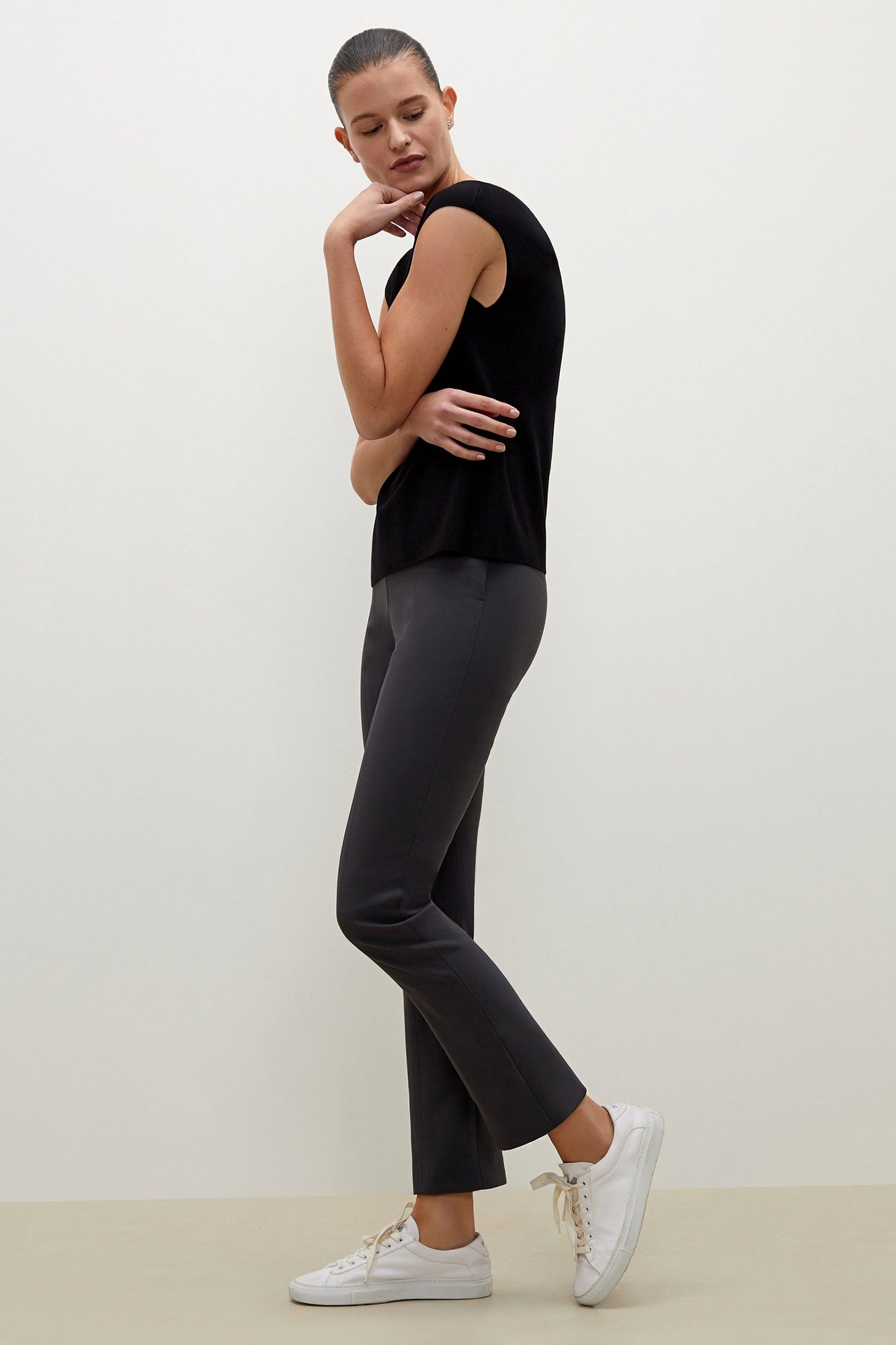 Side image of a woman standing wearing the foster pant in monsoon | Exclude