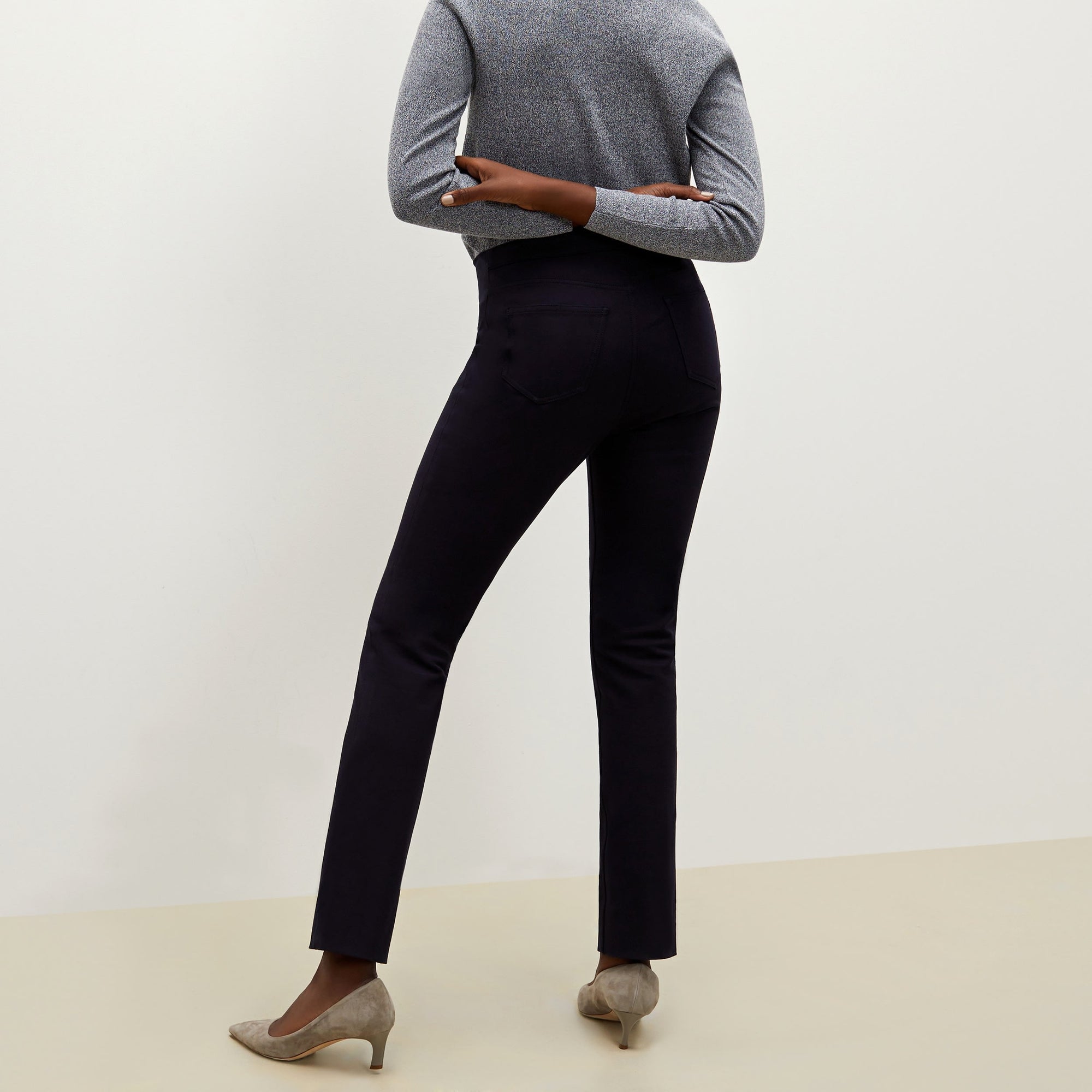 Back image of a woman standing wearing the Hockley pant in ink | Exclude