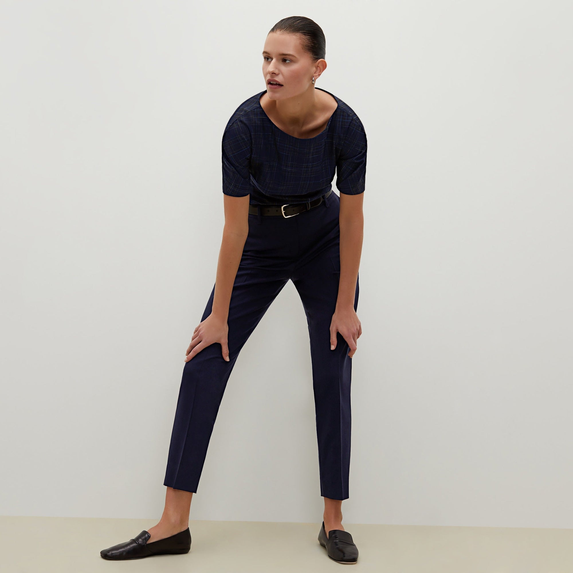 Front image of a woman standing wearing the Mejia pant in Galaxy Blue