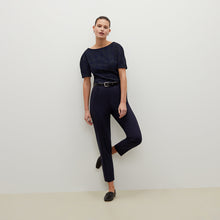 Front image of a woman standing wearing the Mejia pant in Galaxy Blue