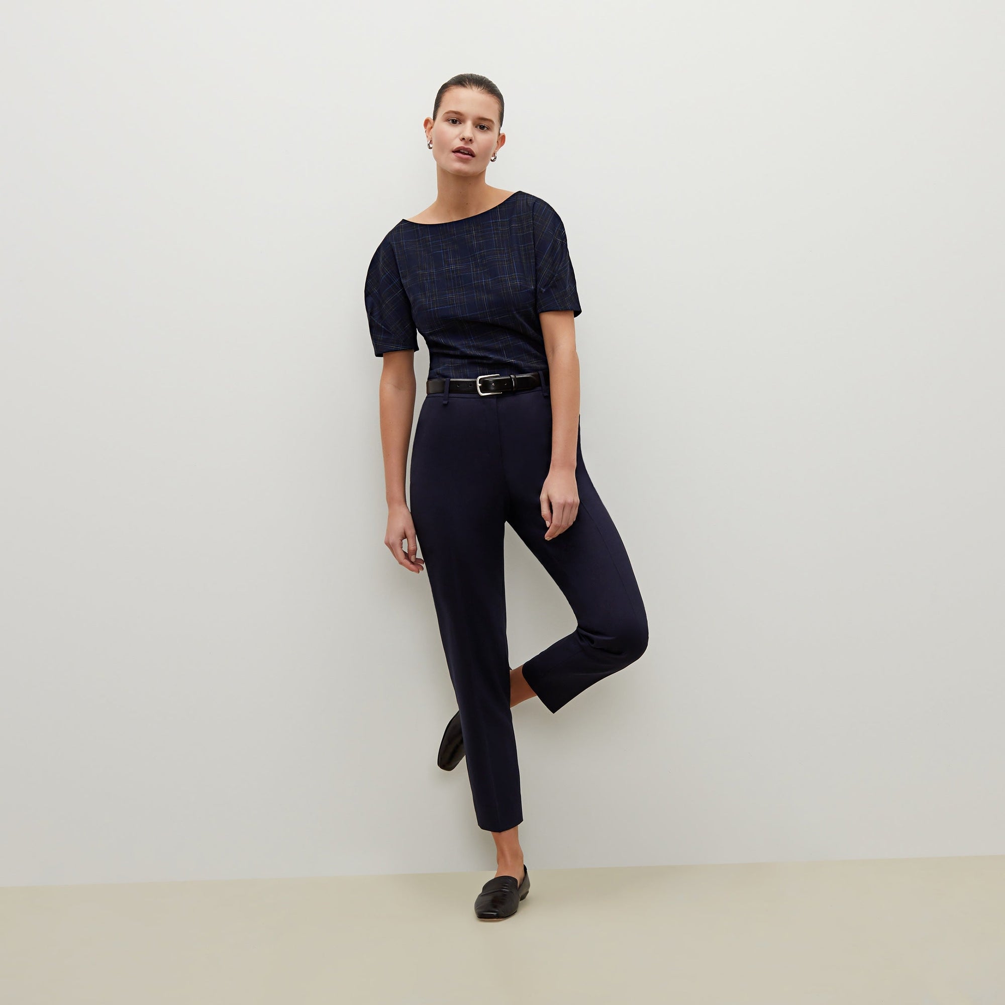 Front image of a woman standing wearing the Mejia pant in Galaxy Blue