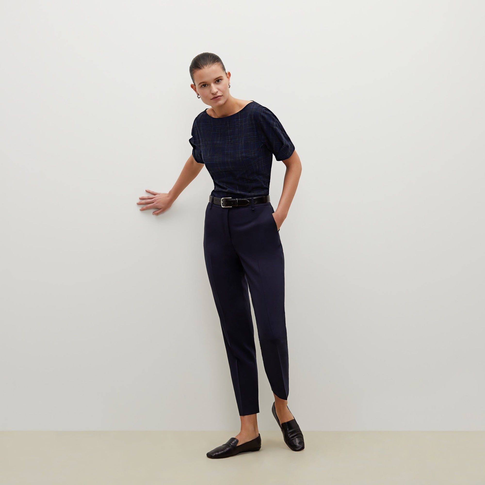 Front image of a woman standing wearing the Mejia pant in Galaxy Blue