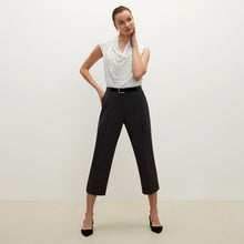 Front image of a woman standing wearing the Isadora pant in charcoal