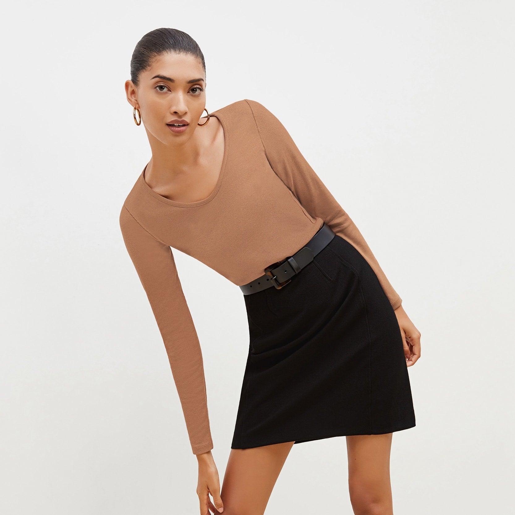 Front image of a woman standing wearing the marcia in camel | Exclude