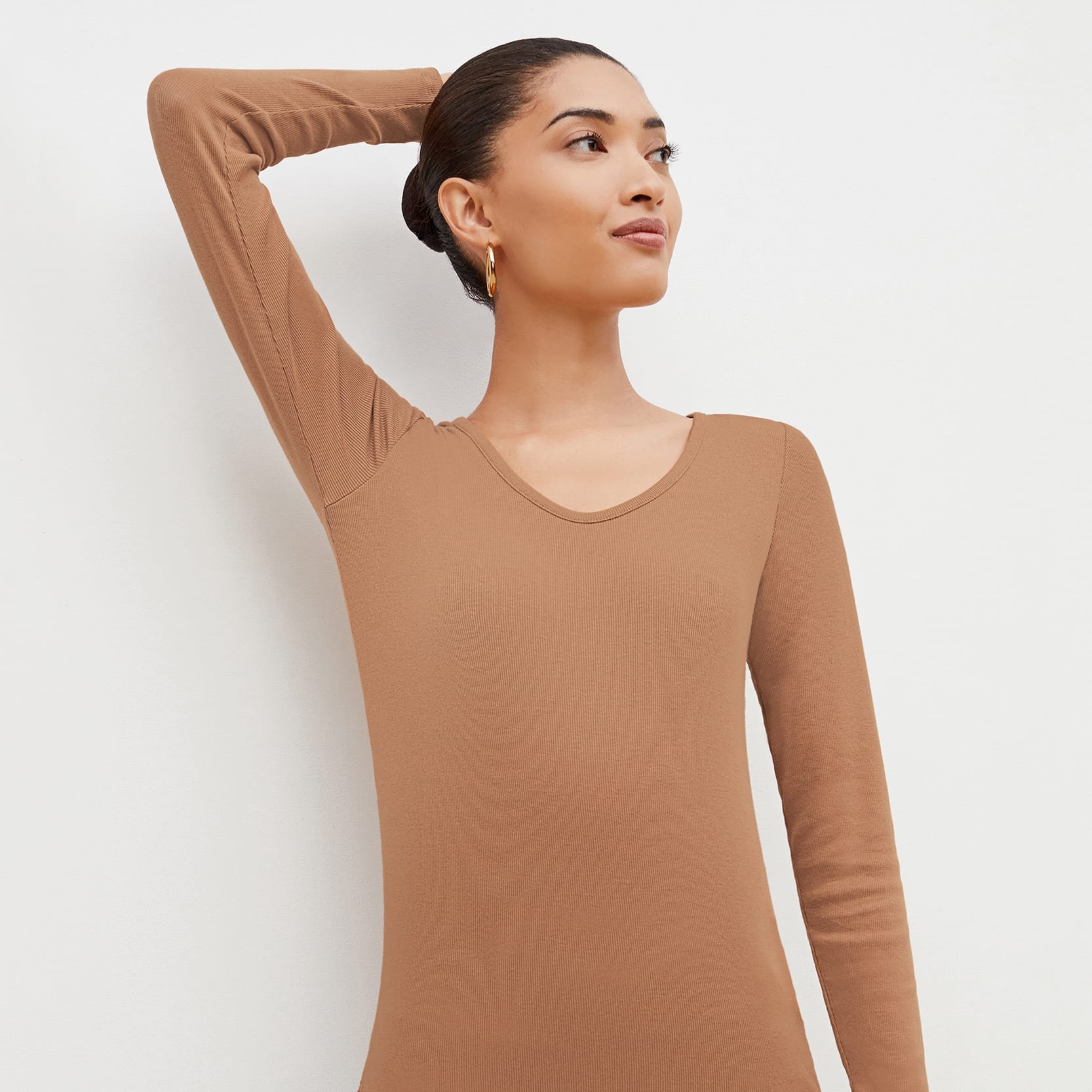 Front image of a woman standing wearing the marcia in camel | Exclude