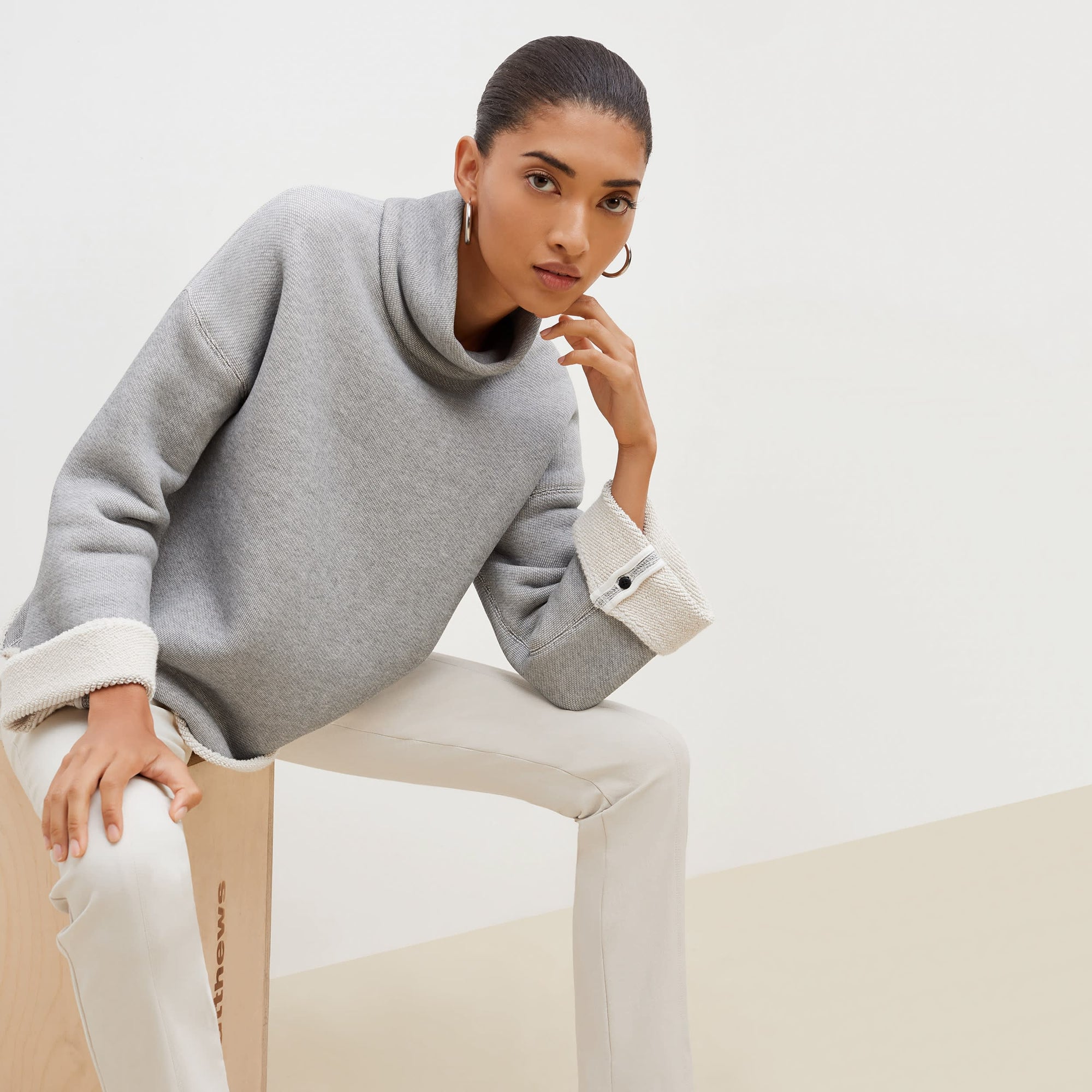 Front image of a woman standing wearing the foster pant in bone | Exclude