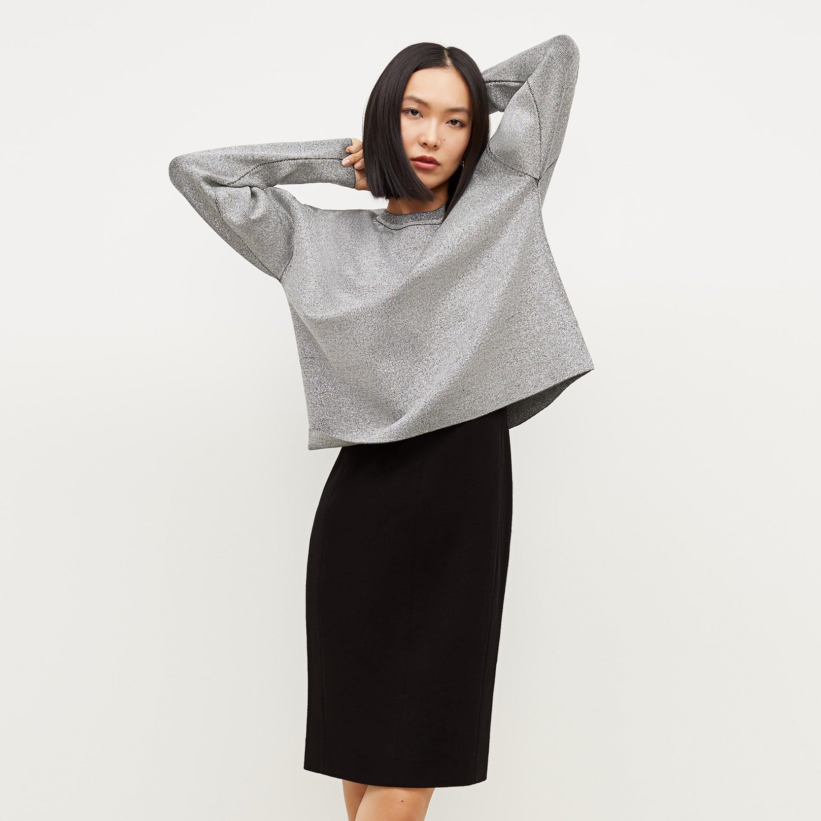 Front image of a woman standing wearing the Rachel dress in black | Exclude