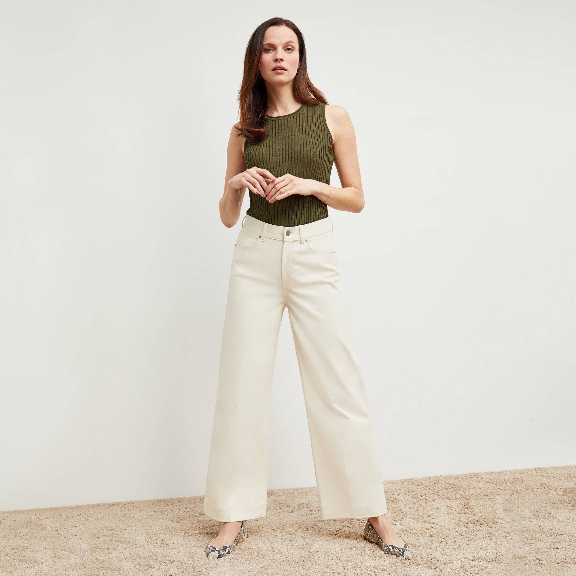 Front image of a woman standing wearing the milo jean in tusk | Exclude