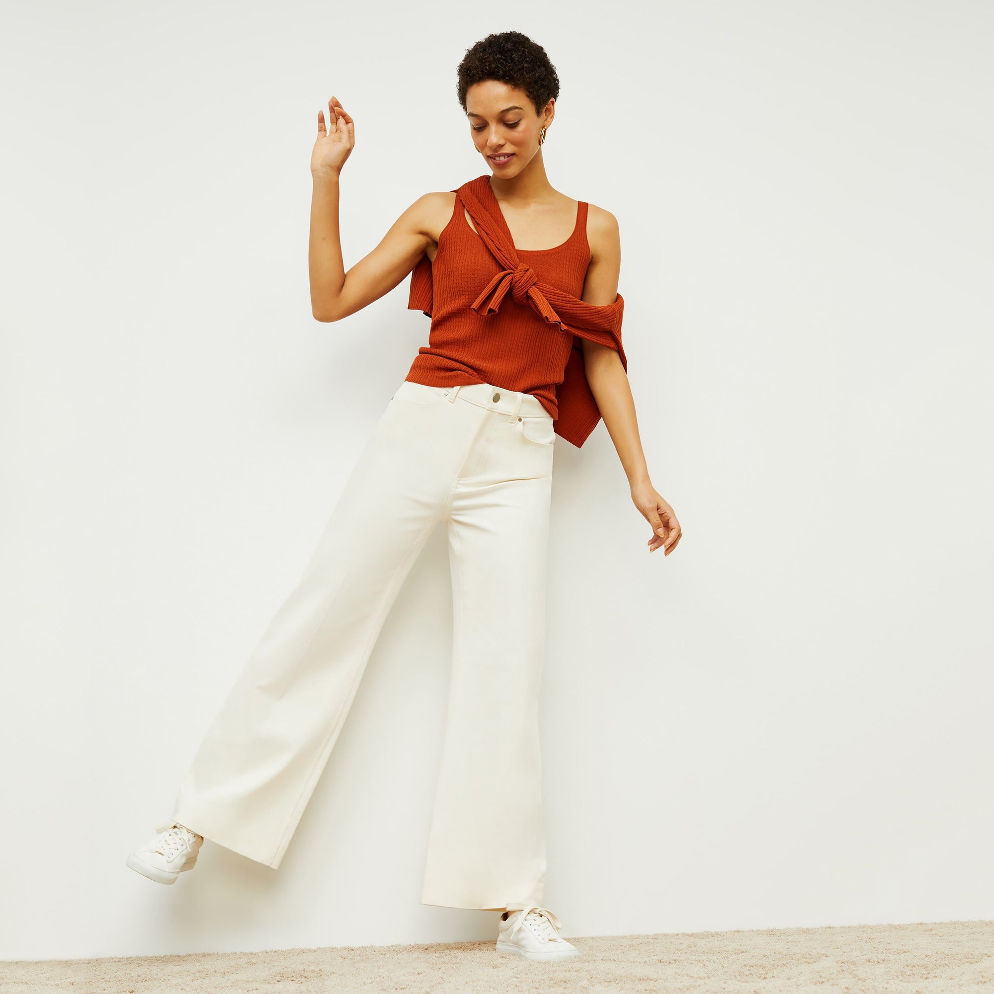 Front image of a woman standing wearing the milo jean in tusk | Exclude