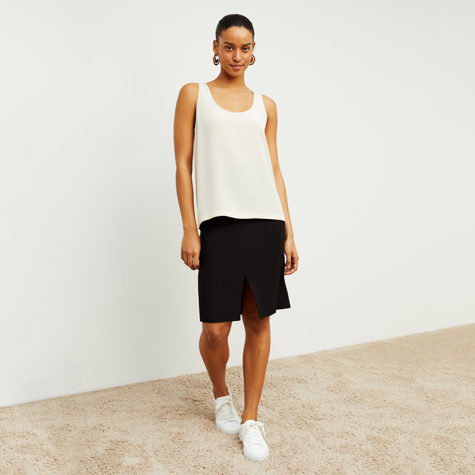 Front image of a woman standing wearing the Vicky Tank—Washable Silk in Pearl | Exclude