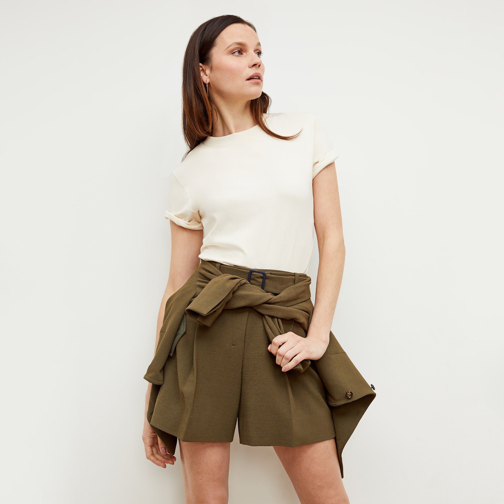 Front image of a woman standing wearing the leslie top in compact cotton in ivory