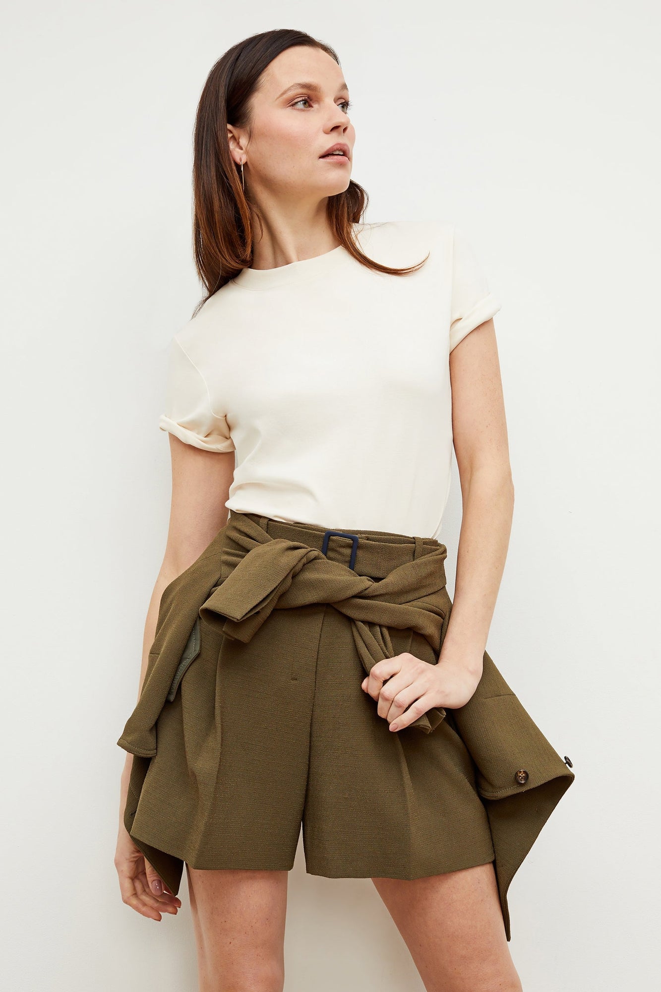 Front image of a woman standing wearing the leslie top in compact cotton in ivory | Grid Hover | Exclude