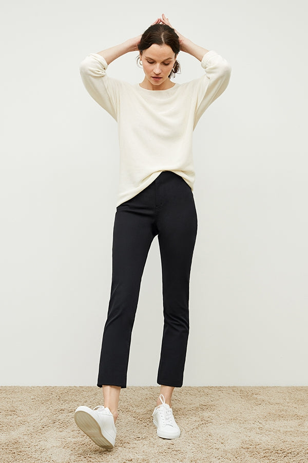 Front image of a woman standing wearing the Hockley pant easy cotton in Black | Exclude | Grid Hover
