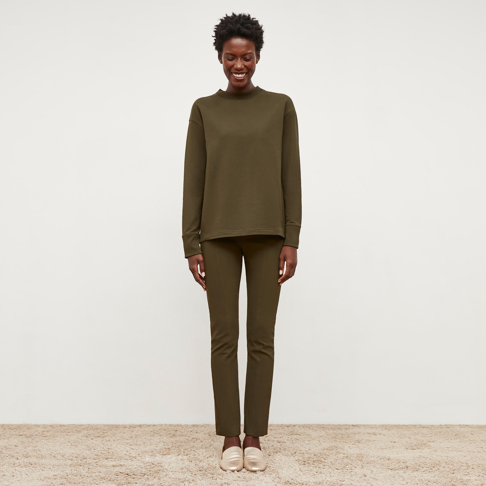 front image of woman wearing foster pant in dark olive | Exclude