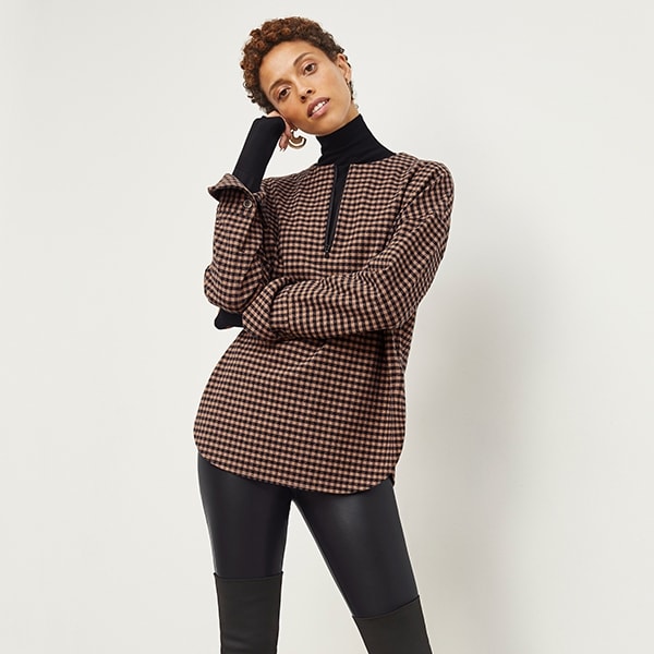 Front image of a woman standing wearing the Harrington Leather—Vegan Leather in Black | Exclude