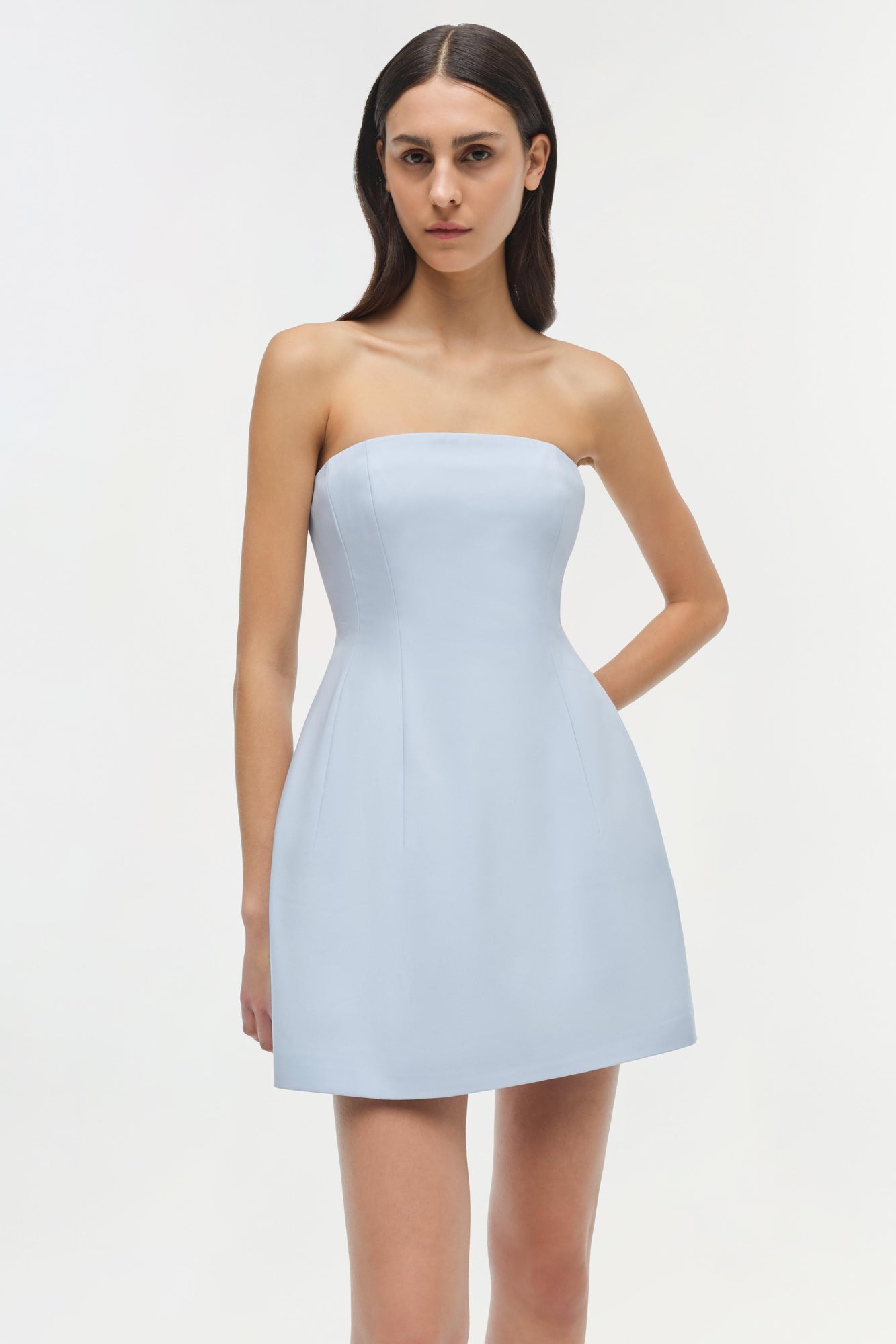 Light blue strapless mini dress with fitted bodice and flared skirt, shown on model.