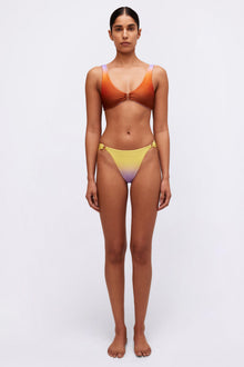 Orange bikini top with front tie detail and gradient yellow-to-purple bikini bottom with side hardware.
