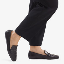 image of a woman wearing the Grace Loafer—Kidskin in Black