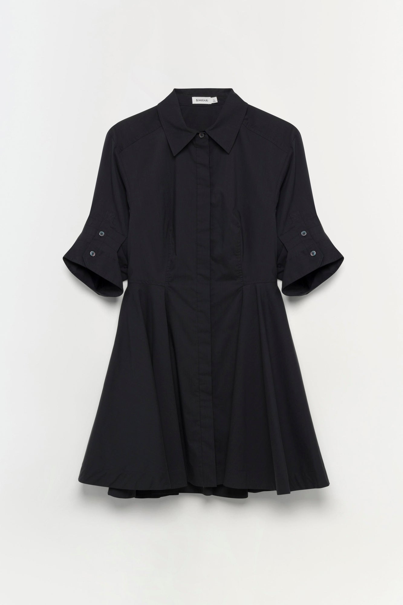 Black button-front shirt dress with three-quarter length sleeves and pleated skirt detail.