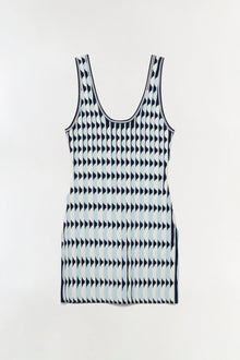 Sleeveless knit mini dress with scalloped edges in navy and white geometric pattern.