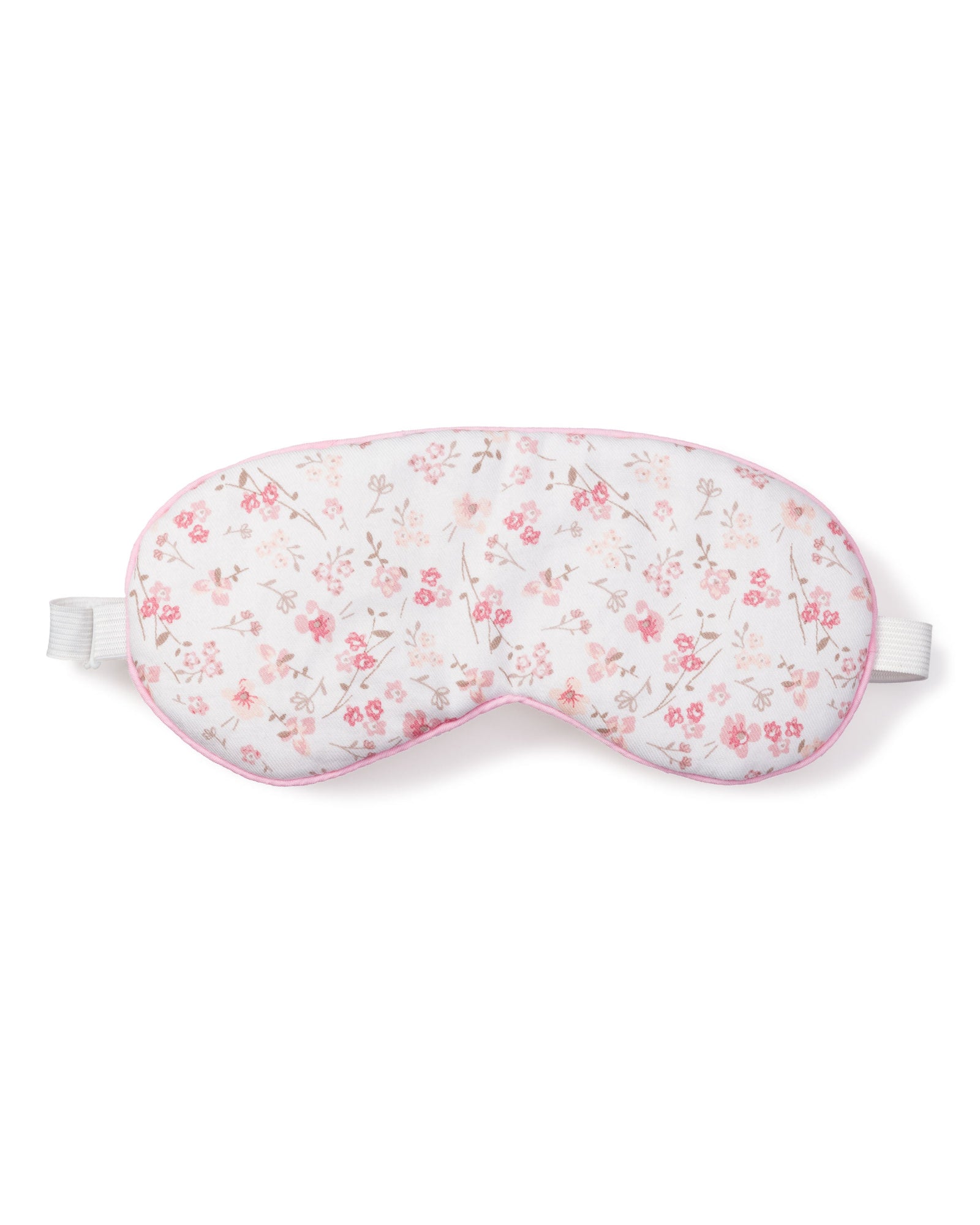 Escape to a luxury dreamland with Petite Plumes Adults Sleep Mask in Dorset Floral, featuring a floral pattern of small pink flowers and leaves, soft pink trim, and an adjustable white elastic strap for a secure light-blocking fit.