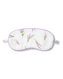 The Kids Sleep Mask in Fields of Provence by Petite Plume offers a luxurious sleep experience with its elegant purple floral design, light purple trim, elastic strap, and subtle side label. Ideal for monogramming, it makes the perfect gift.