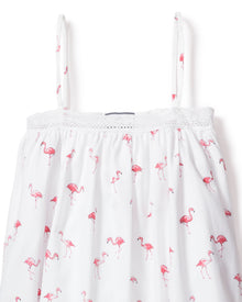 Indulge in the luxurious Girls Twill Lily Nightgown by Petite Plume. This white nightgown, adorned with thin straps and crochet trim, features playful pink flamingos for a tropical bedtime twist.