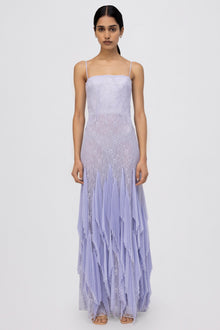 Lavender lace gown with thin straps, fitted bodice, and pleated skirt with layered hem.