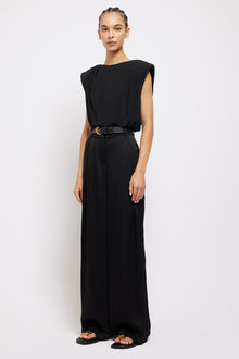 Black wide-leg Mercer Pant with high waist and front pleats, worn with matching sleeveless top and belt.