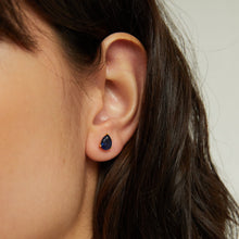 Lifestyle Model side profile of woman wearing blue stone stud