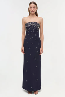 Navy strapless gown with scattered silver beading concentrated at neckline and dispersed down the floor-length skirt.