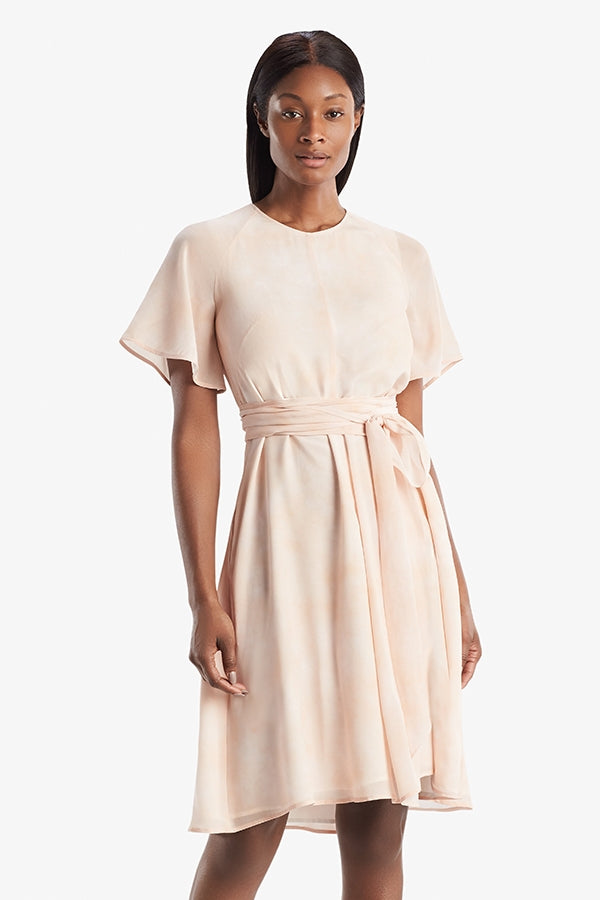 Front image of a woman standing wearing the Jessica Dress in ballet | Grid | Exclude