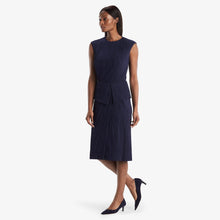Hero image of a woman standing wearing the Montgomery Skirt in aegean blue | Lead