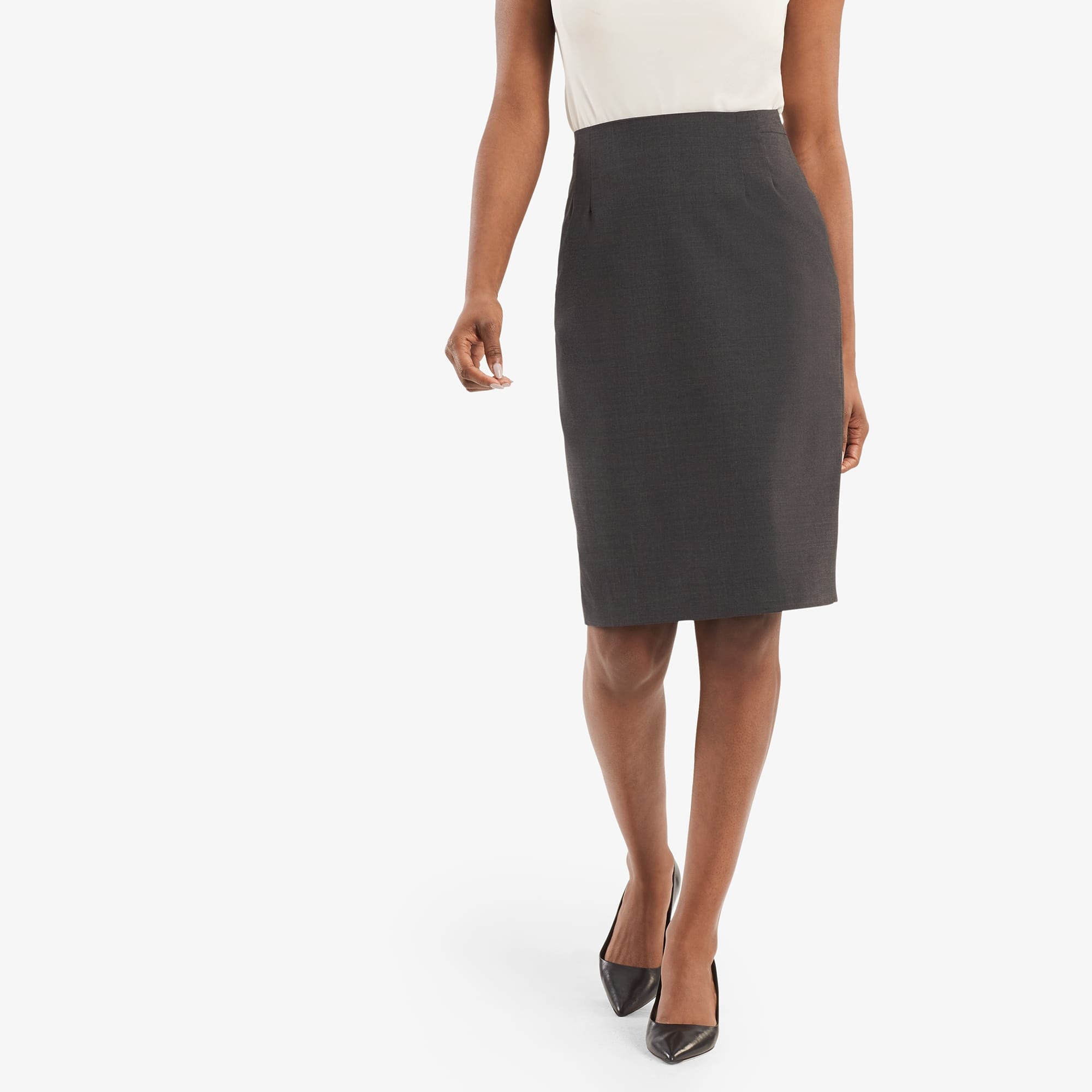 Front image of a woman standing wearing the Cobble Hill skirt in gray melange. | Exclude