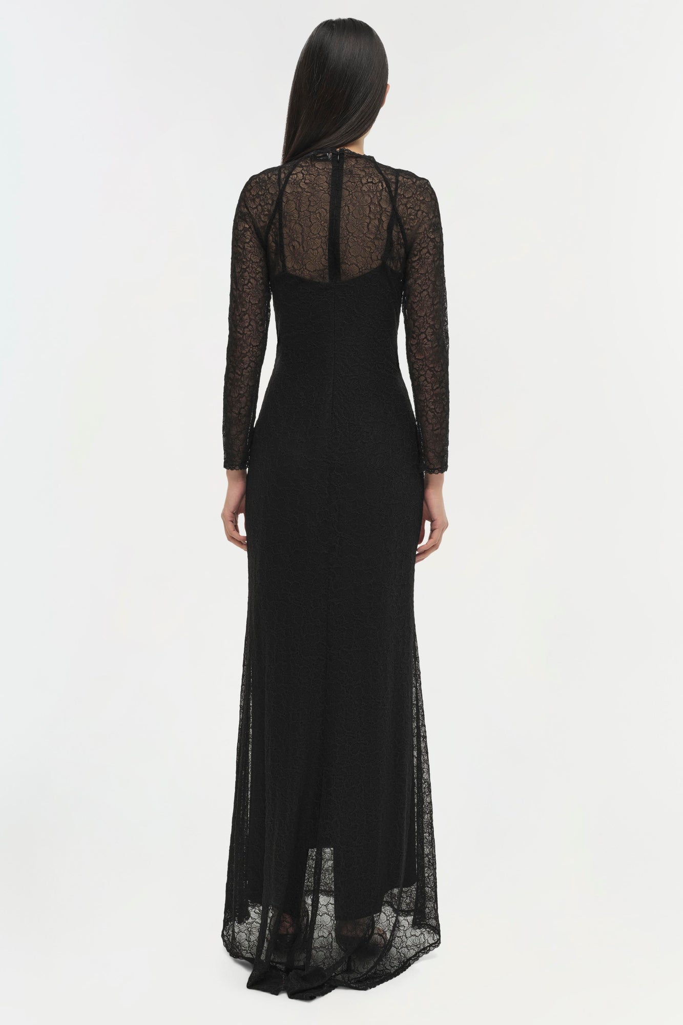 Black long-sleeved gown with lace bodice and sleeves, fitted waist, and floor-length skirt with lace hem.
