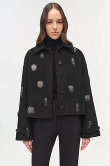 Black wool jacket with silver embroidered dash details, button front closure, and oversized collar.