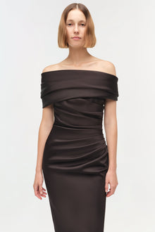 Black off-shoulder satin gown with draped neckline and ruched waist detail.