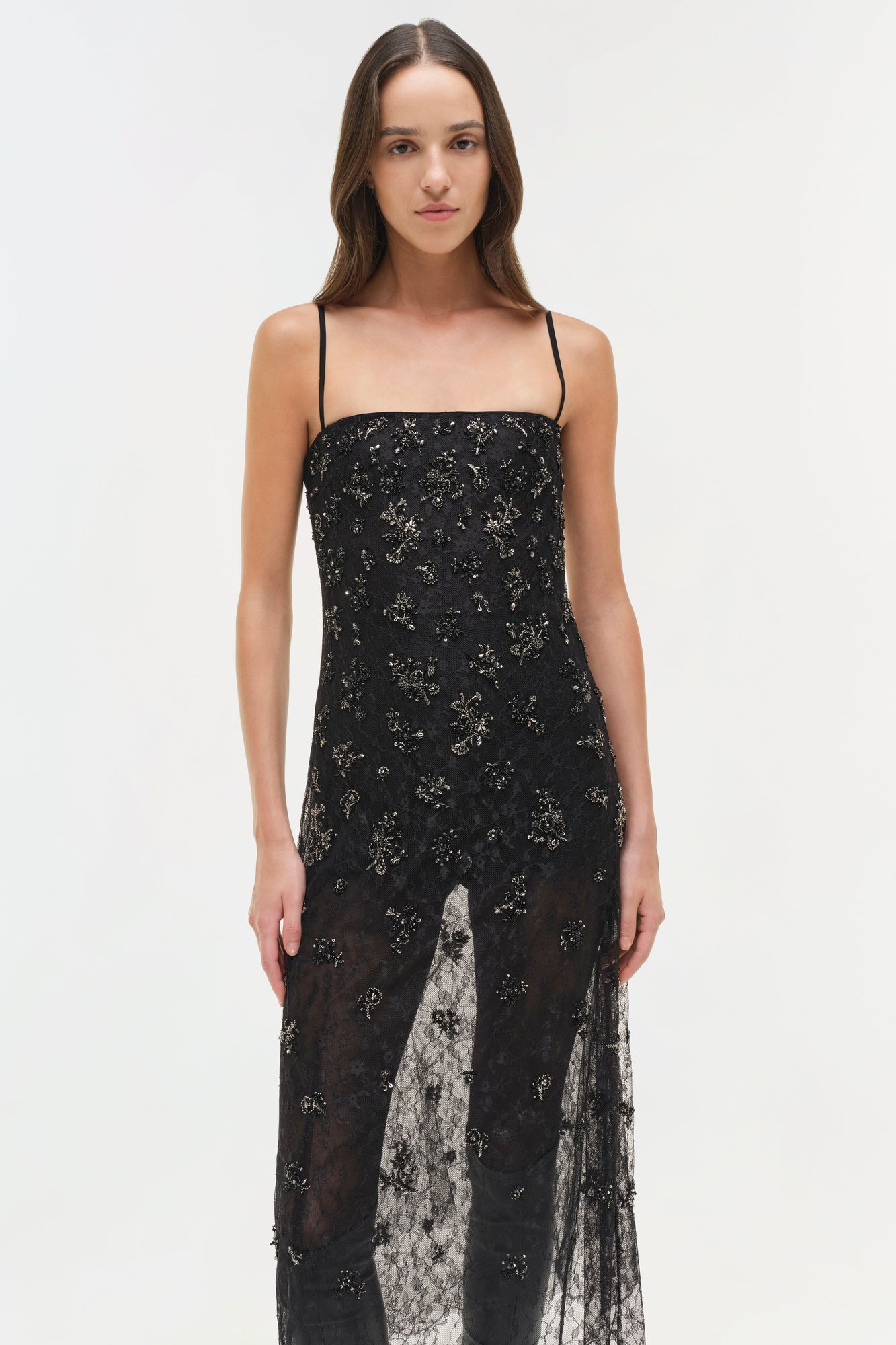Black lace midi dress with embellished beading, thin straps, and front slit detail.