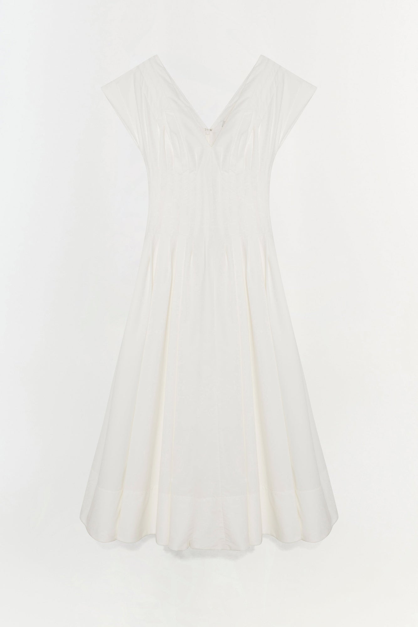 White cotton midi dress with cap sleeves, V-neckline, and pleated A-line skirt.