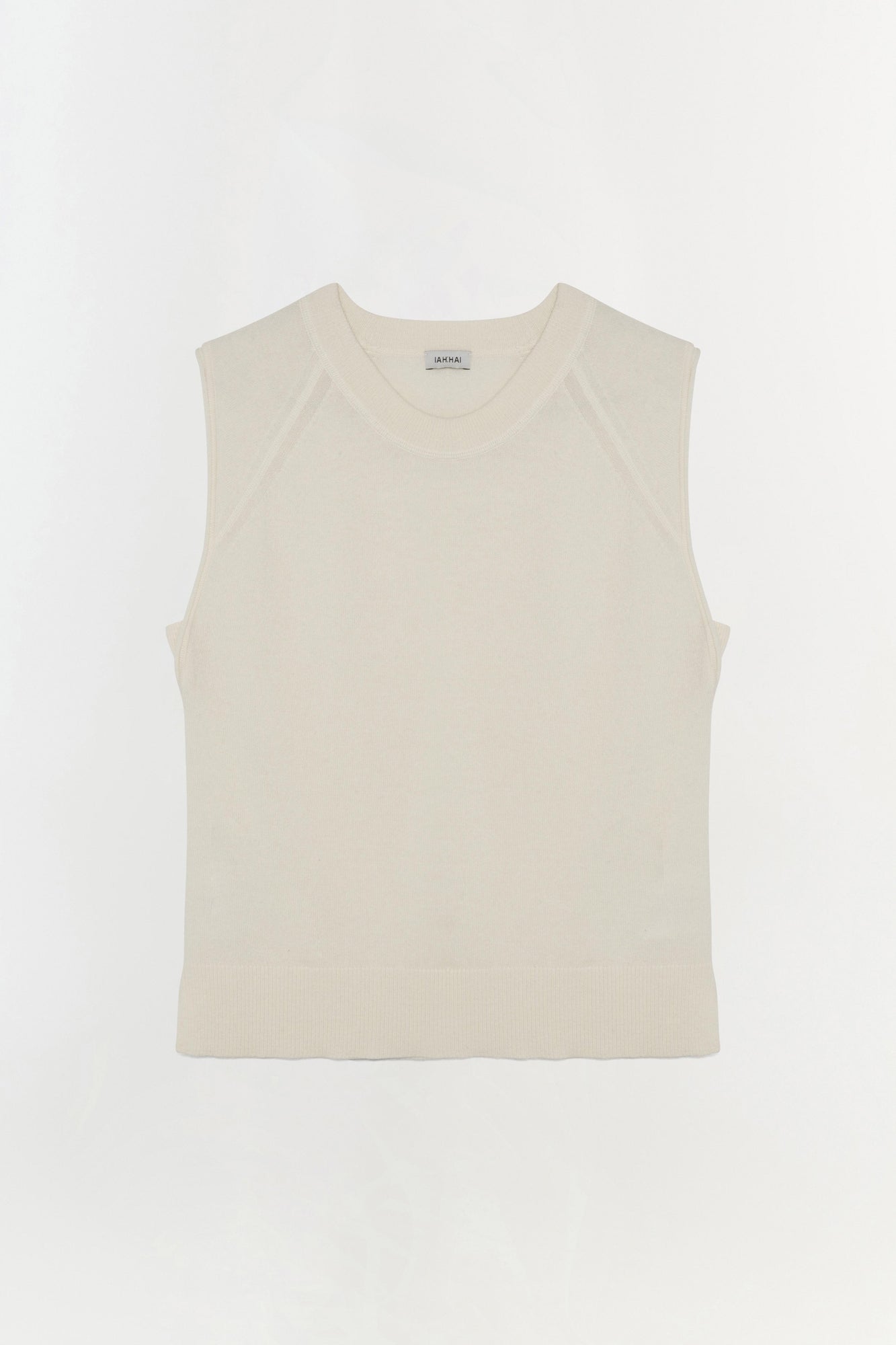 Cream cashmere sleeveless vest with crew neckline and ribbed hem.