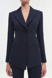 Navy single-breasted blazer with notch lapels, long sleeves, and front button closure.