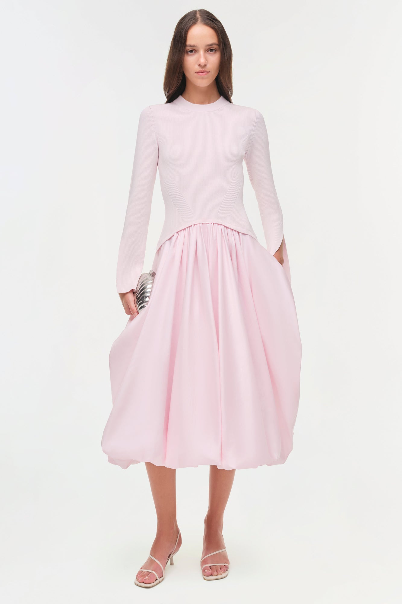 Pink midi dress with long-sleeve ribbed knit top and gathered taffeta skirt.