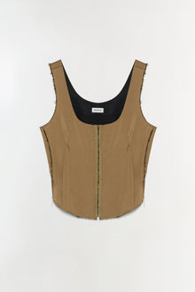 Tan bustier top with black lining, front zip closure, and raw edges on sleeveless straps and sides.