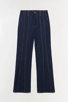 Dark blue denim trousers with vertical tan stitching and a relaxed, wide-leg silhouette.