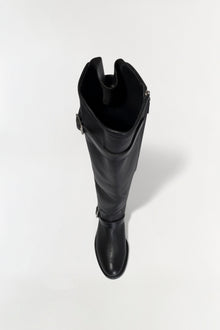 Black leather over-the-knee boot with buckle straps on the side, shown from above against a white background.