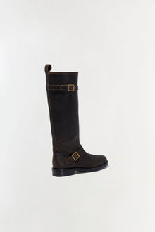 Black leather moto boot with buckle straps and flat sole, shown from the back angle.
