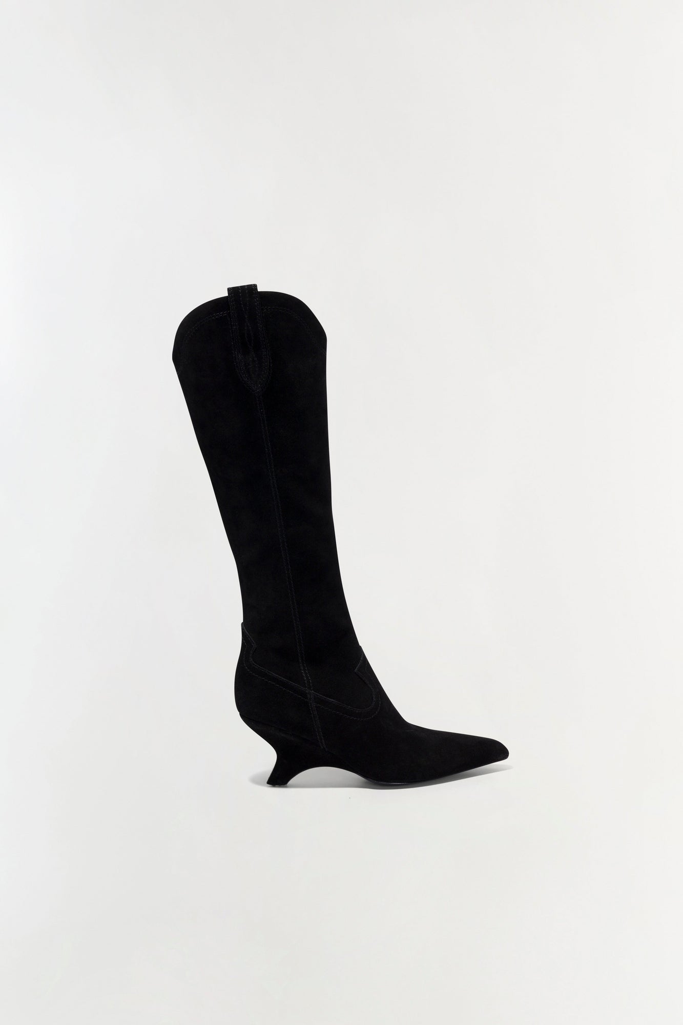 Black suede knee-high boot with a curved heel and center zipper, shown in profile on a neutral background.