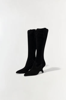 Black suede knee-high boots with pointed toes and kitten heels, shown from the front on a neutral background.